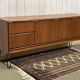 1970s English enfilade in teak with splayed legs.