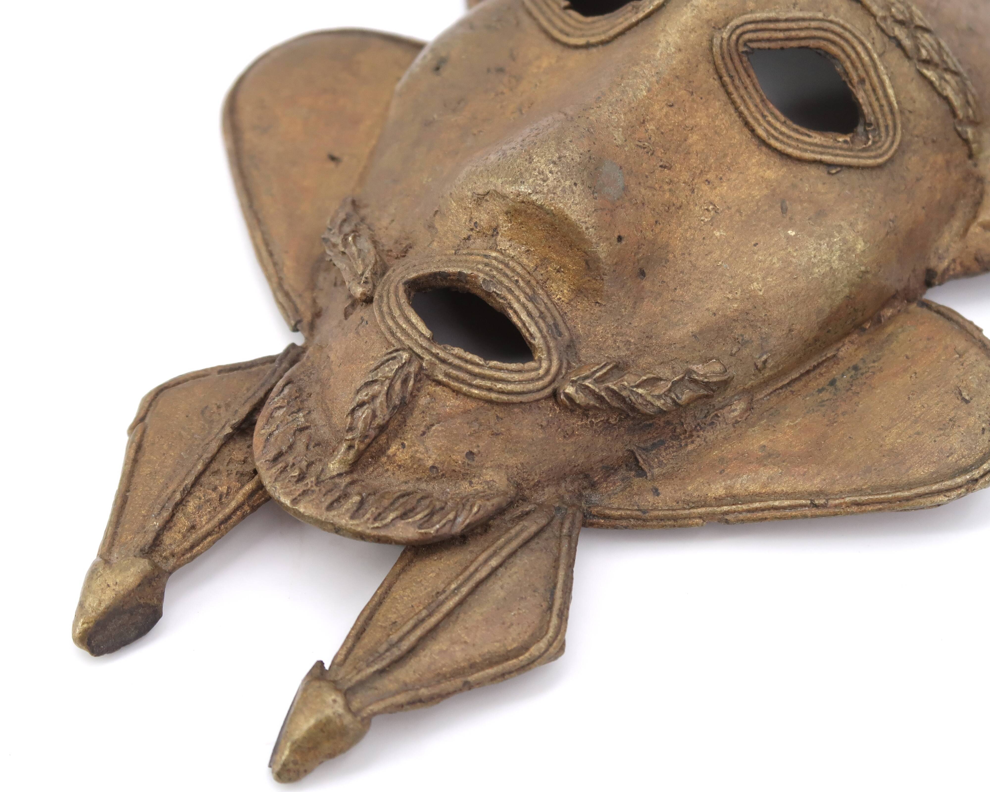 Pair of African brass masks, 1970s