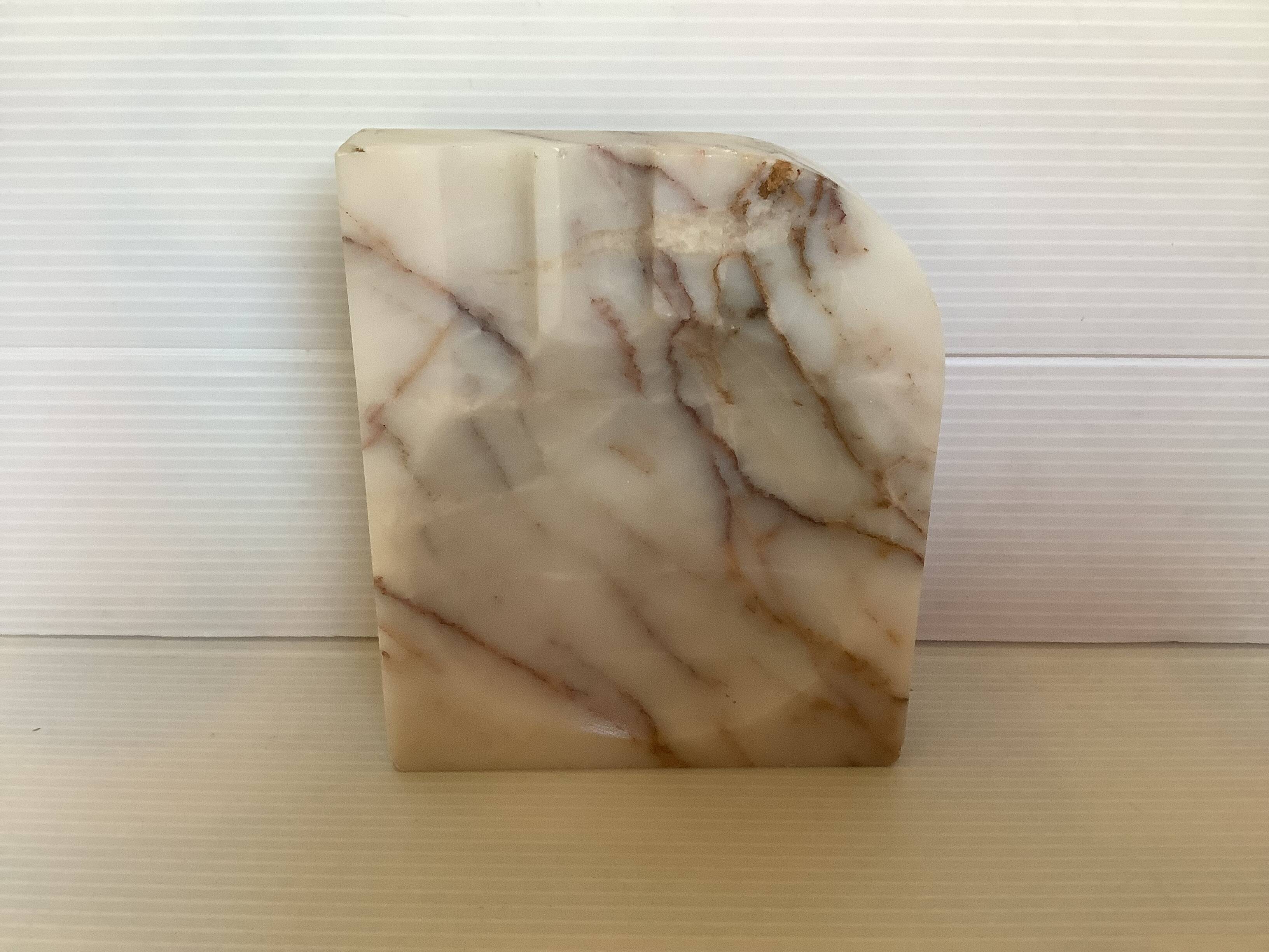 Asymmetrical marble ashtray emptier