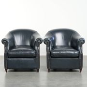 Set of dark blue cow leather club armchairs with a unique design