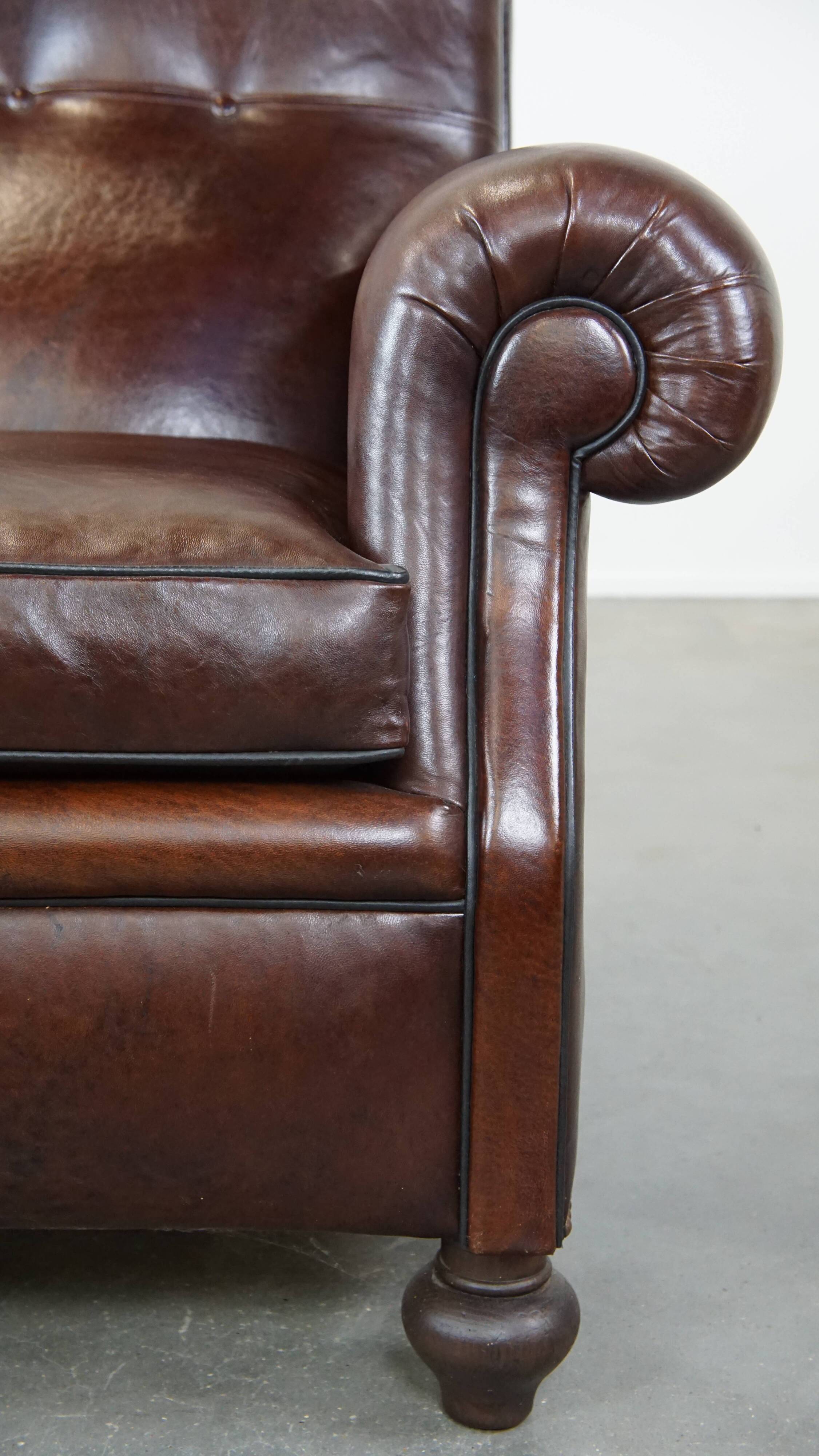 Antique sheep leather English armchair