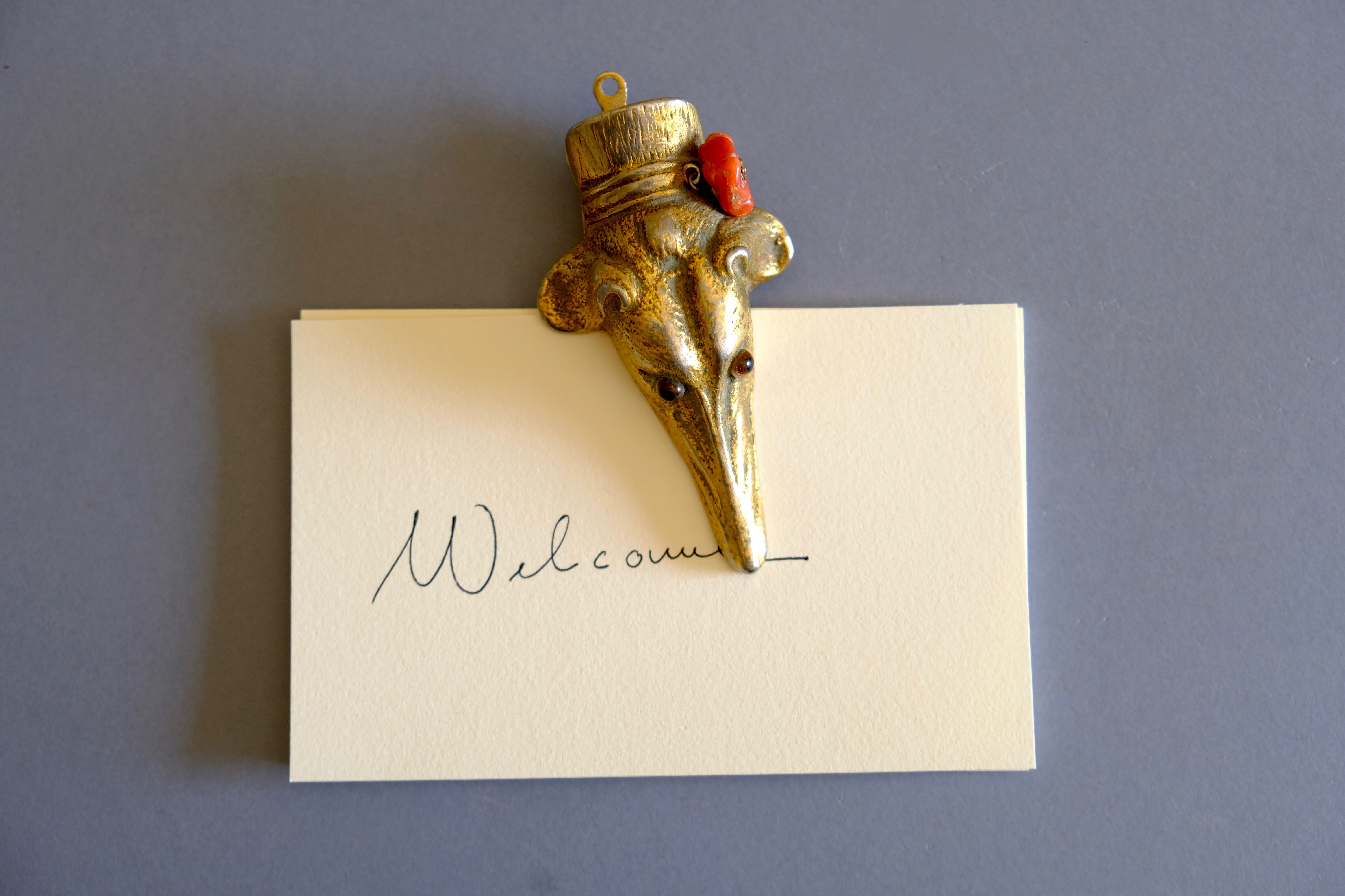 Ancient greyhound-headed mail clip, bronze