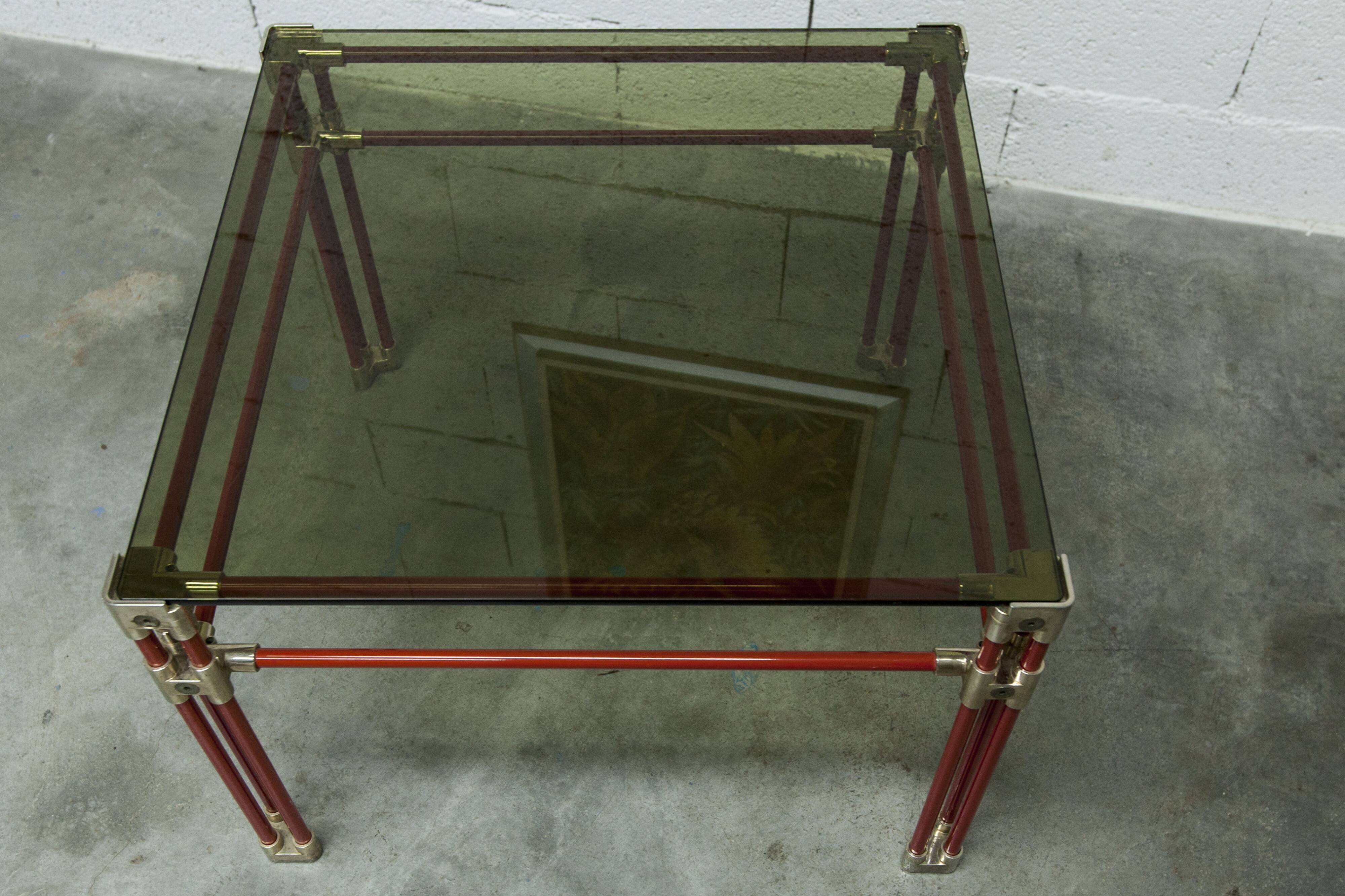 Postmodern Italian design coffee table in smoked glass with red steel structure