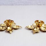 Pair of brass "flower" candlesticks