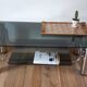 Table basse en verre fumé et pieds chromés années 70