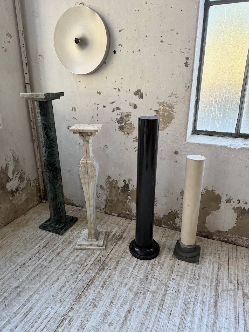 Set of 4 marble columns or pedestals.