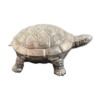 Ancient tortoise in silver metal