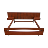 Teak bed with hanging bedside tables from the 60s