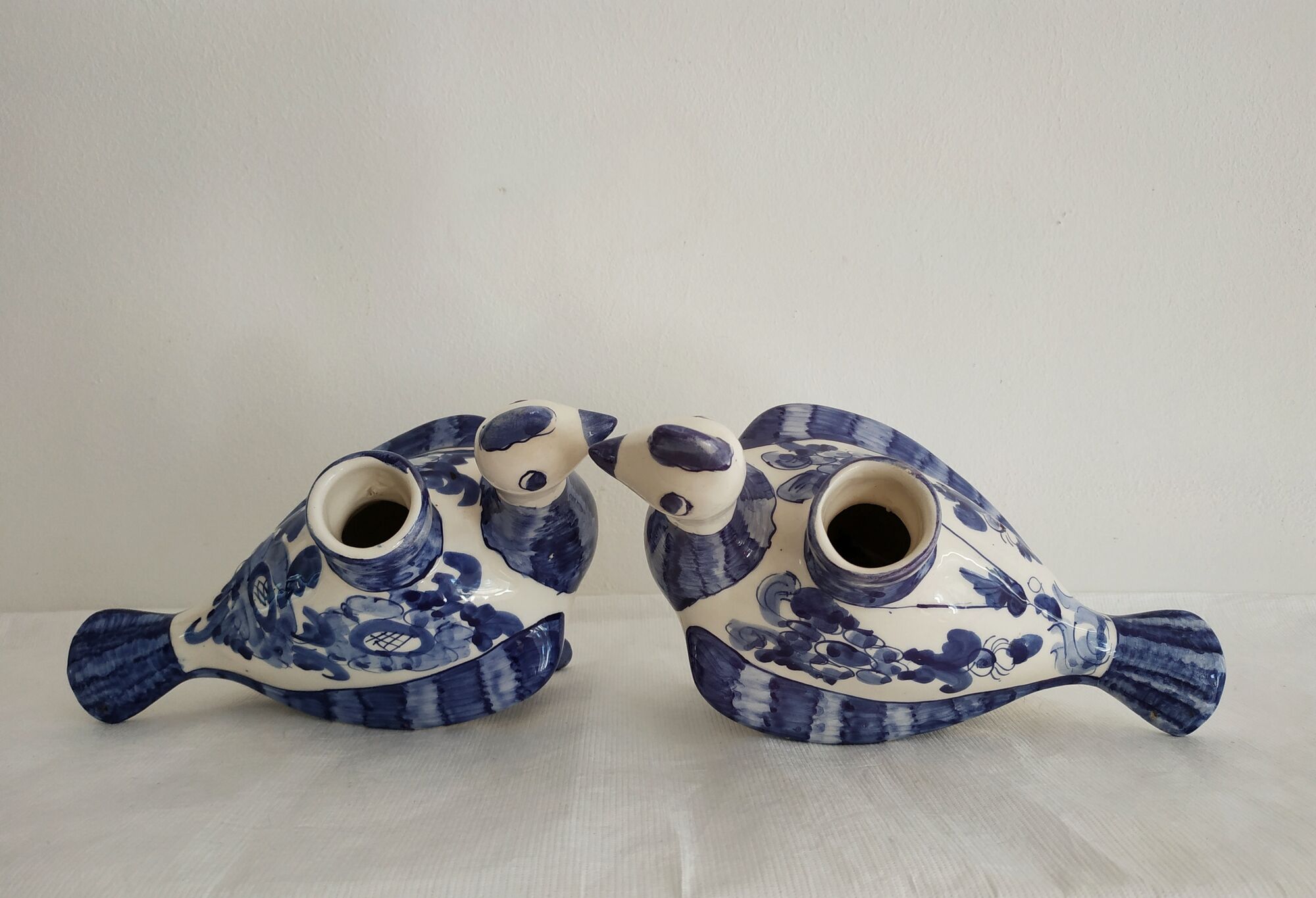 Pair of bird candlesticks in blue white, Skyros earthenware