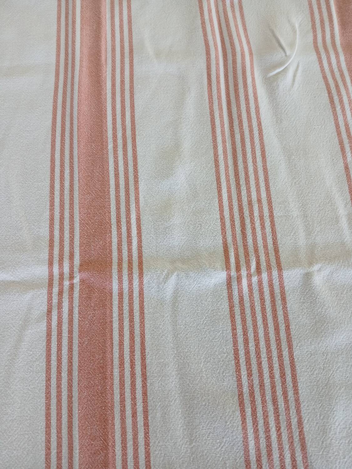 Old pink and white tablecloth