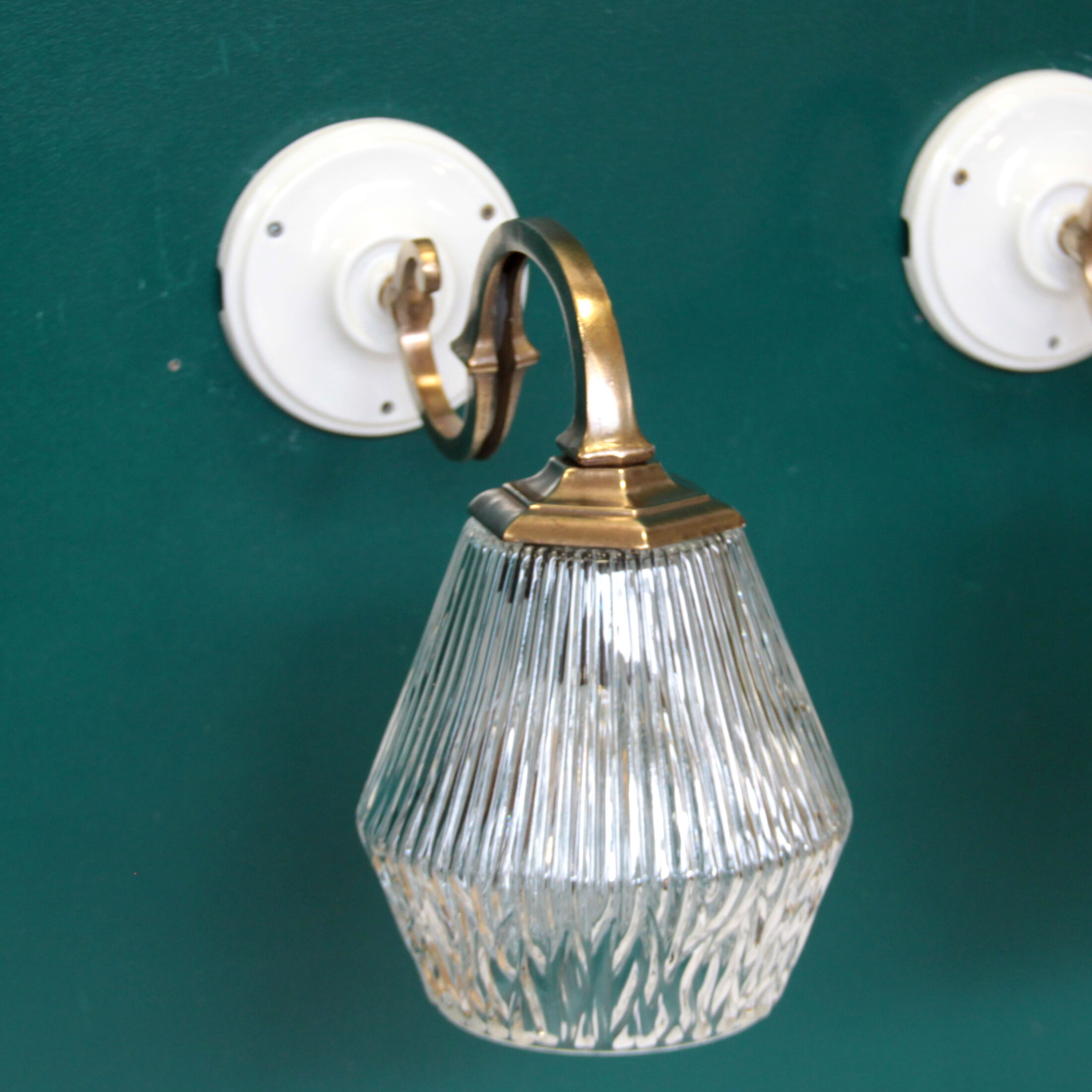 Pair of brass gooseneck wall sconces and glass globe vintage porcelain rosette