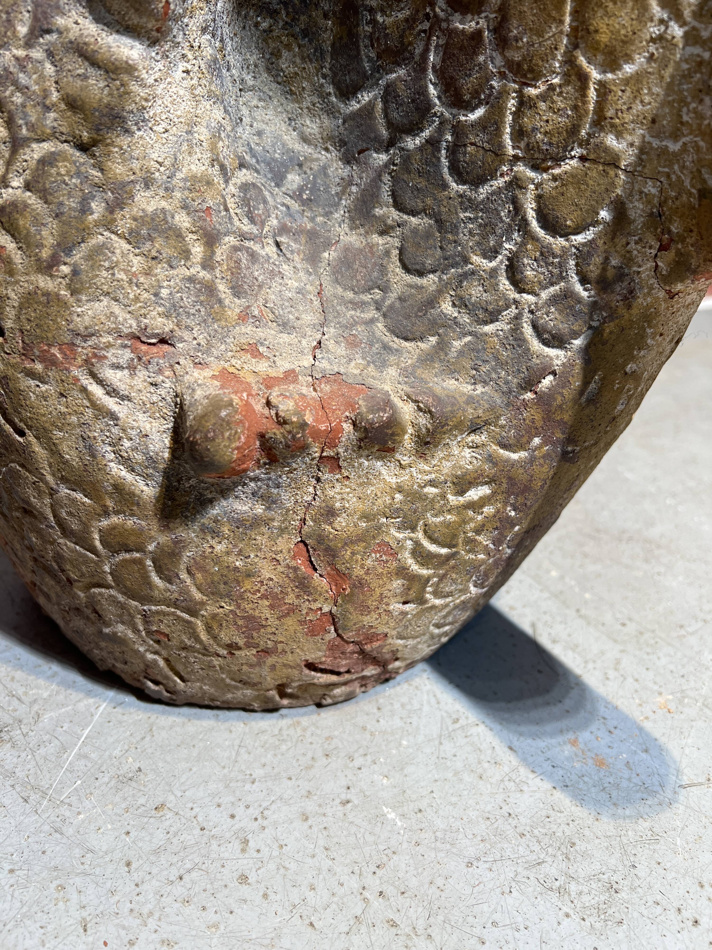 Terracotta umbrella stand in the shape of a fish