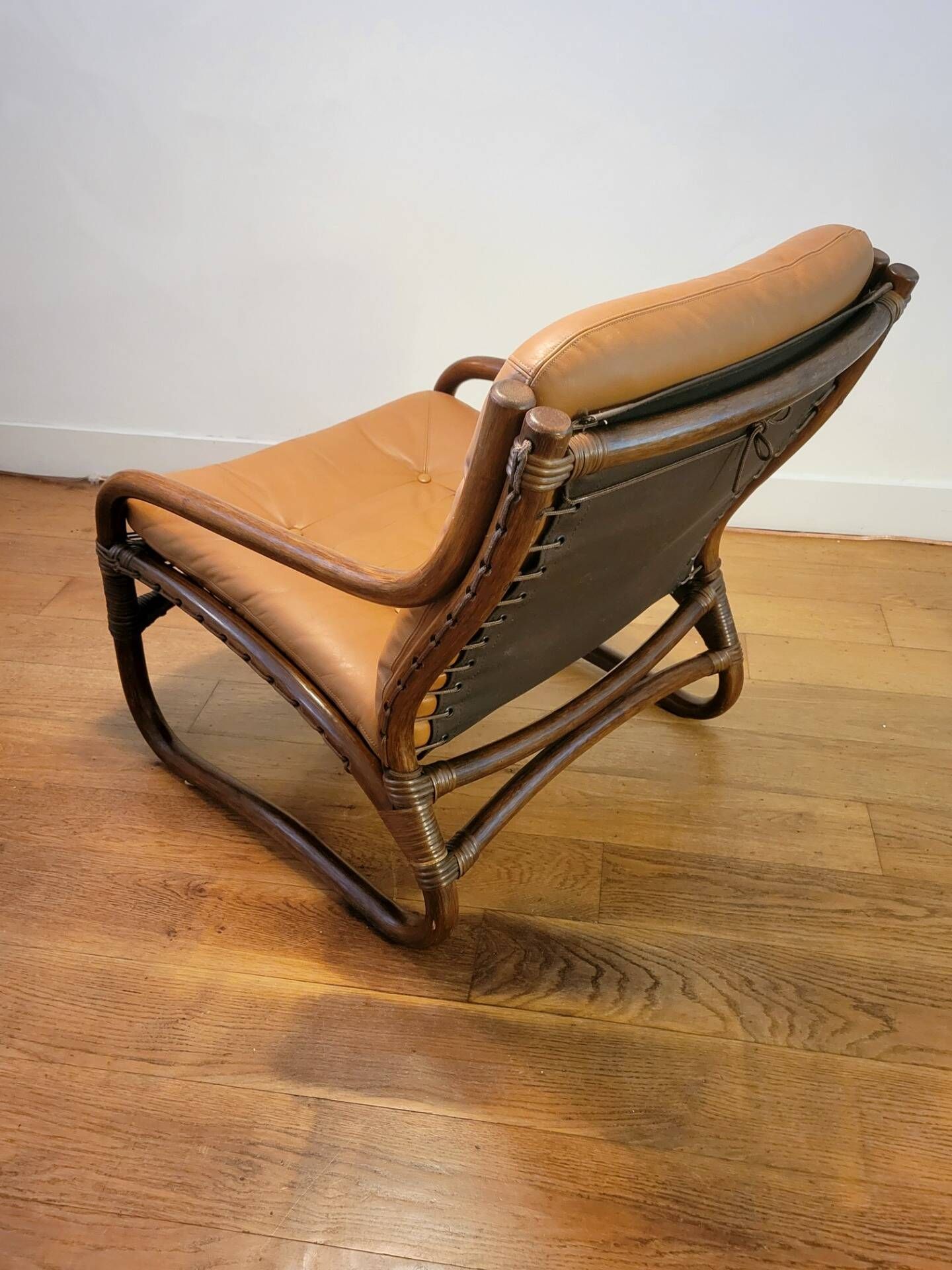 Vintage rattan armchair with leather cushions from 1970