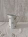 Earthenware milk jug with small flower patterns.