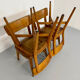 Set of 4 vintage solid oak chairs, 1960s design with sculpted backrest.