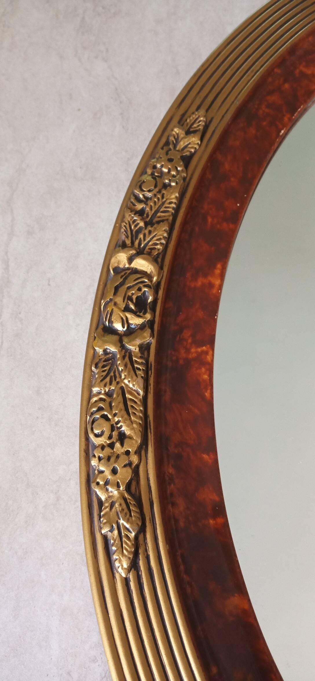 Modern oval mirror with flower decoration