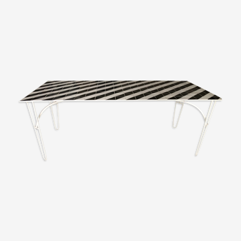 Iron table with top in black and white ceramic tiles