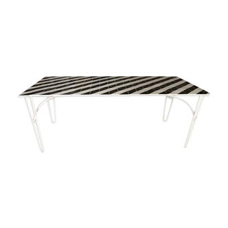 Iron table with top in black and white ceramic tiles