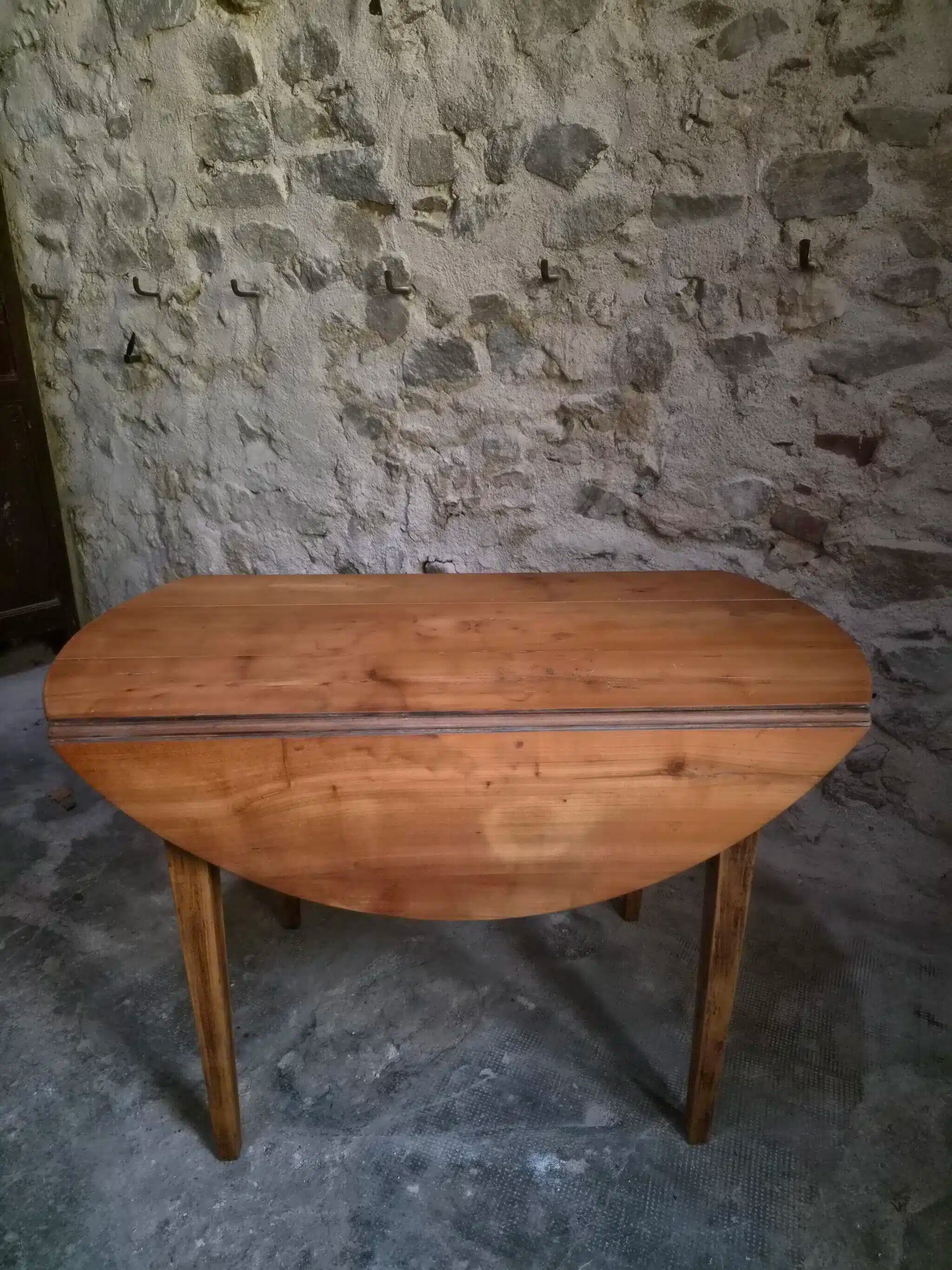 Rustic French antique dining table, drop-leaf table in cherry wood, circa 1900.