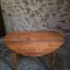 Rustic French antique dining table, drop-leaf table in cherry wood, circa 1900.