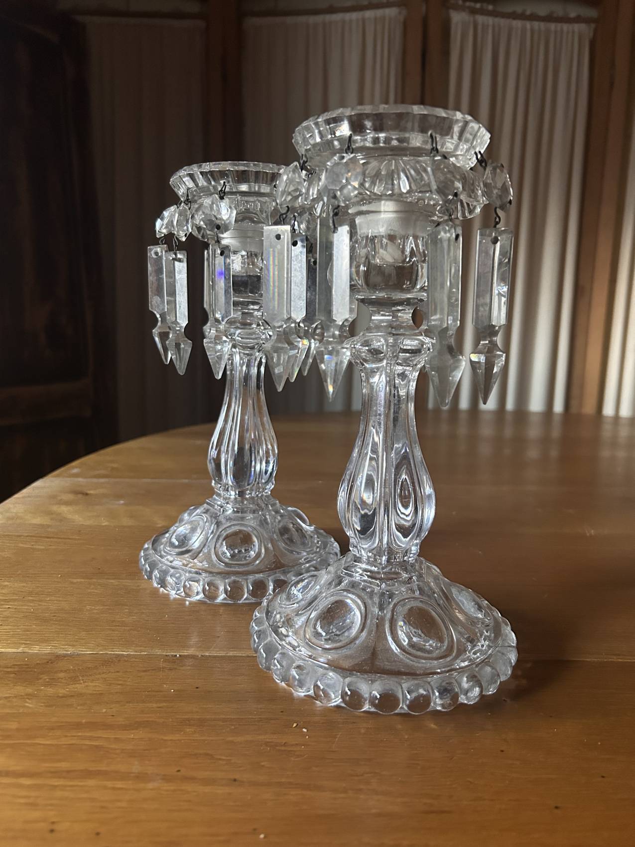Pair of large Baccarat crystal candlesticks with pendants, a rare choice.