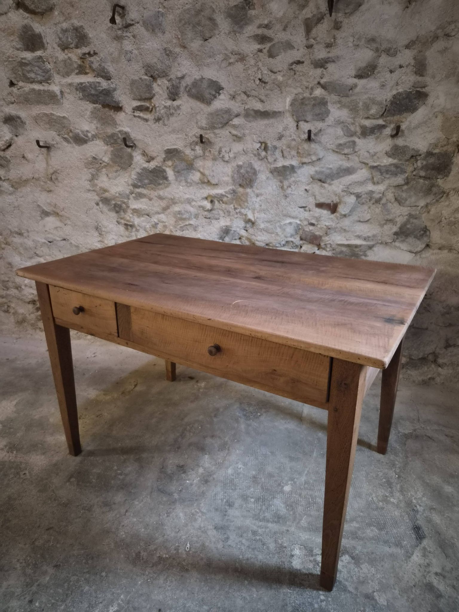 French antique dining table in cherry wood with two drawers, circa 1880–1920.