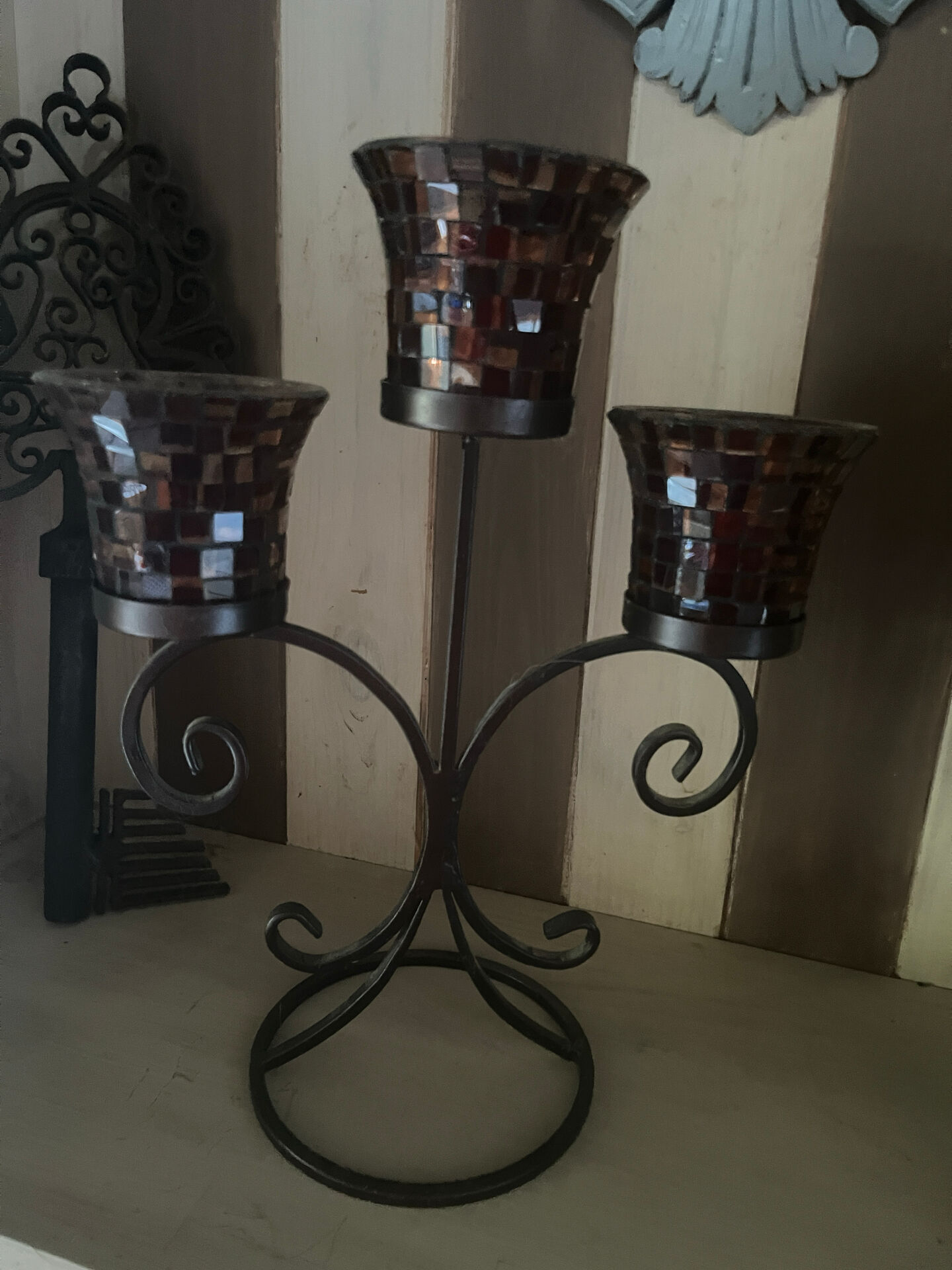Three-branch candlestick in wrought iron and glass mosaic.