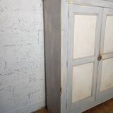 Low Parisian wardrobe with two doors, made of fir with original patina