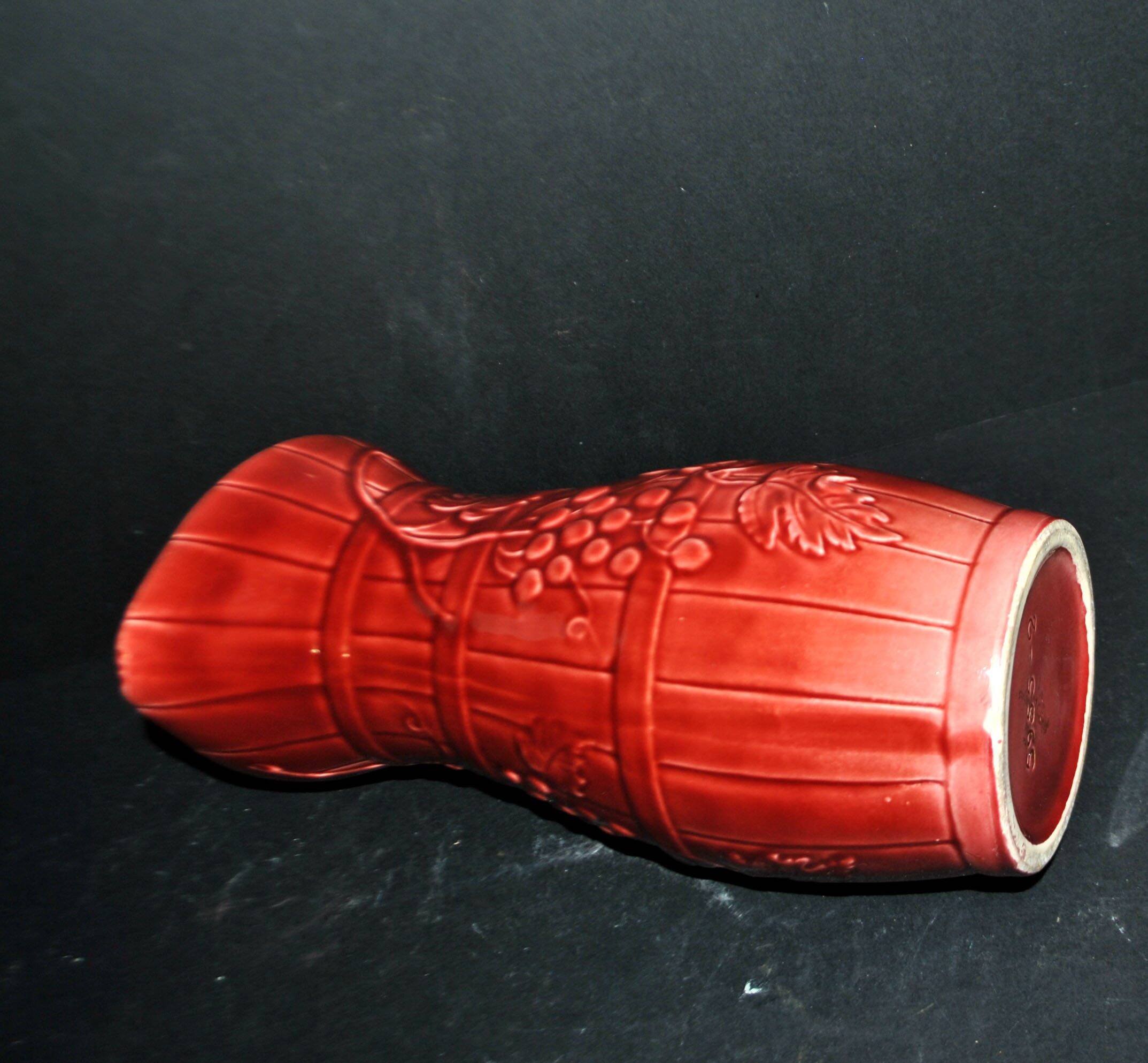 Sarreguemines wine jug in red slipware with grapevine decoration.