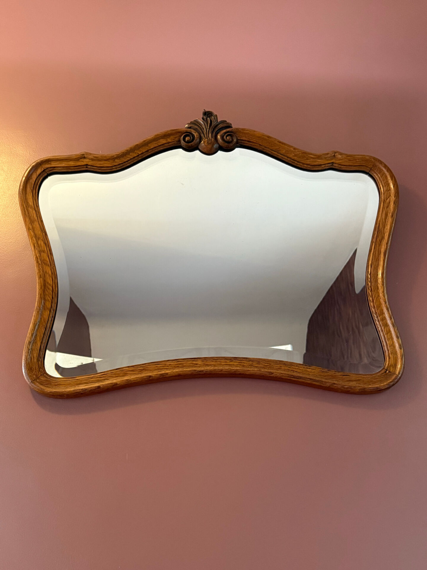 Antique bevelled mirror, oak frame