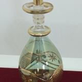Vial / perfume bottle in tinted and cut glass golden border