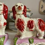 Pair of Staffordshire porcelain Cavalier King Charles dogs on terrace, 19th century.