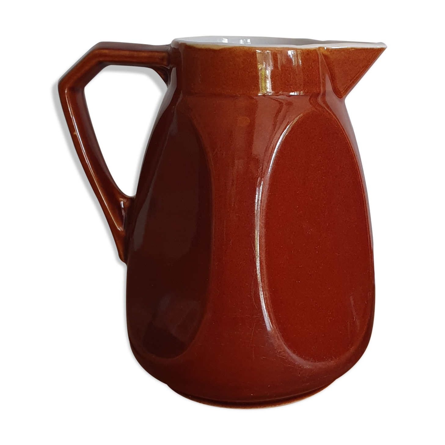 Pitcher in brown sandstone