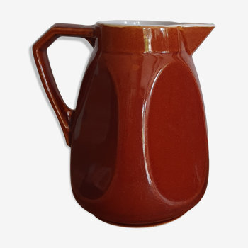 Pitcher in brown sandstone