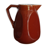 Pitcher in brown sandstone