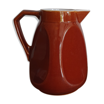 Pitcher in brown sandstone