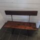 Old garden bench with iron legs and wooden seats