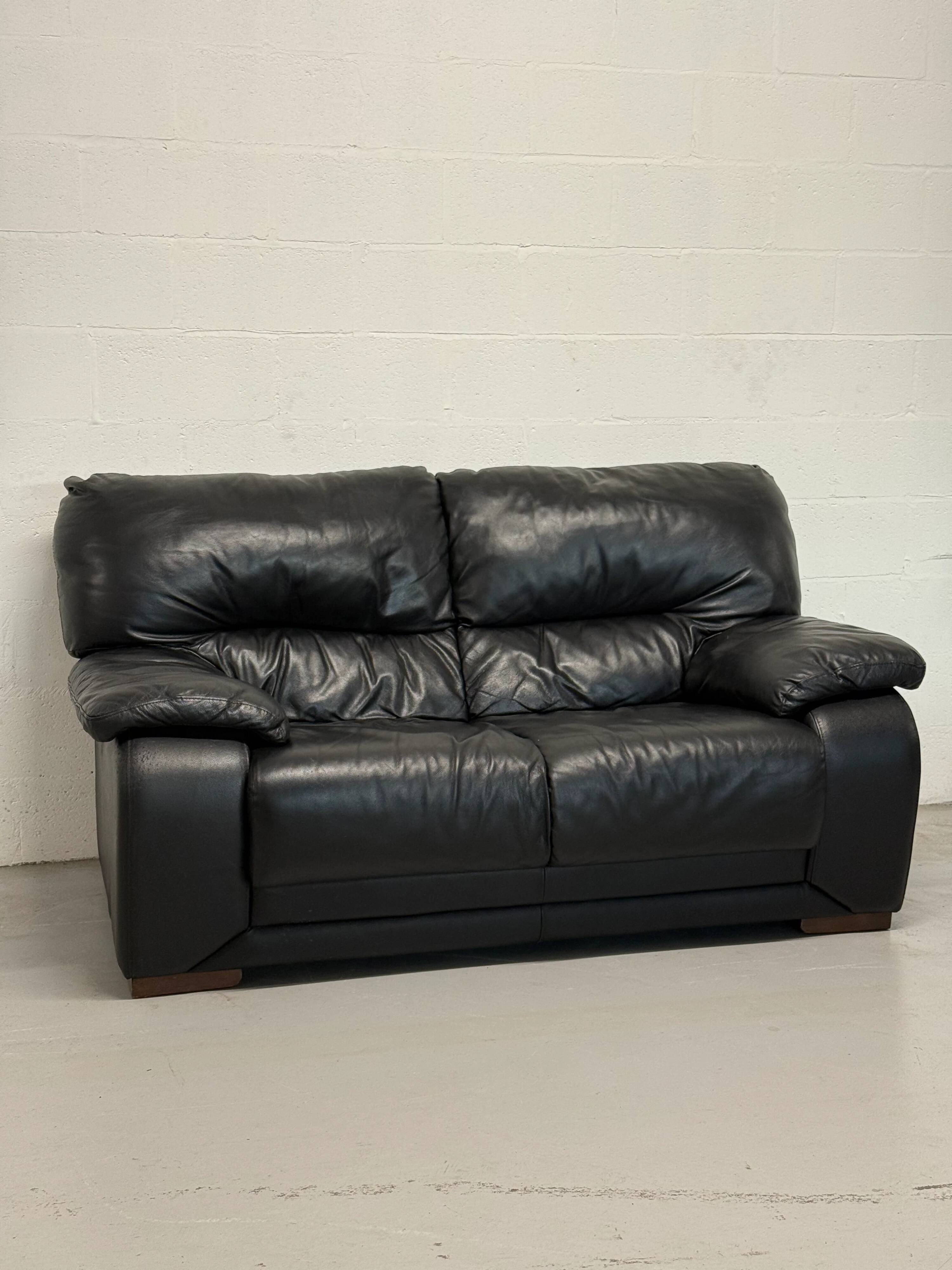 Two-seater black leather sofa — Italian postmodern design