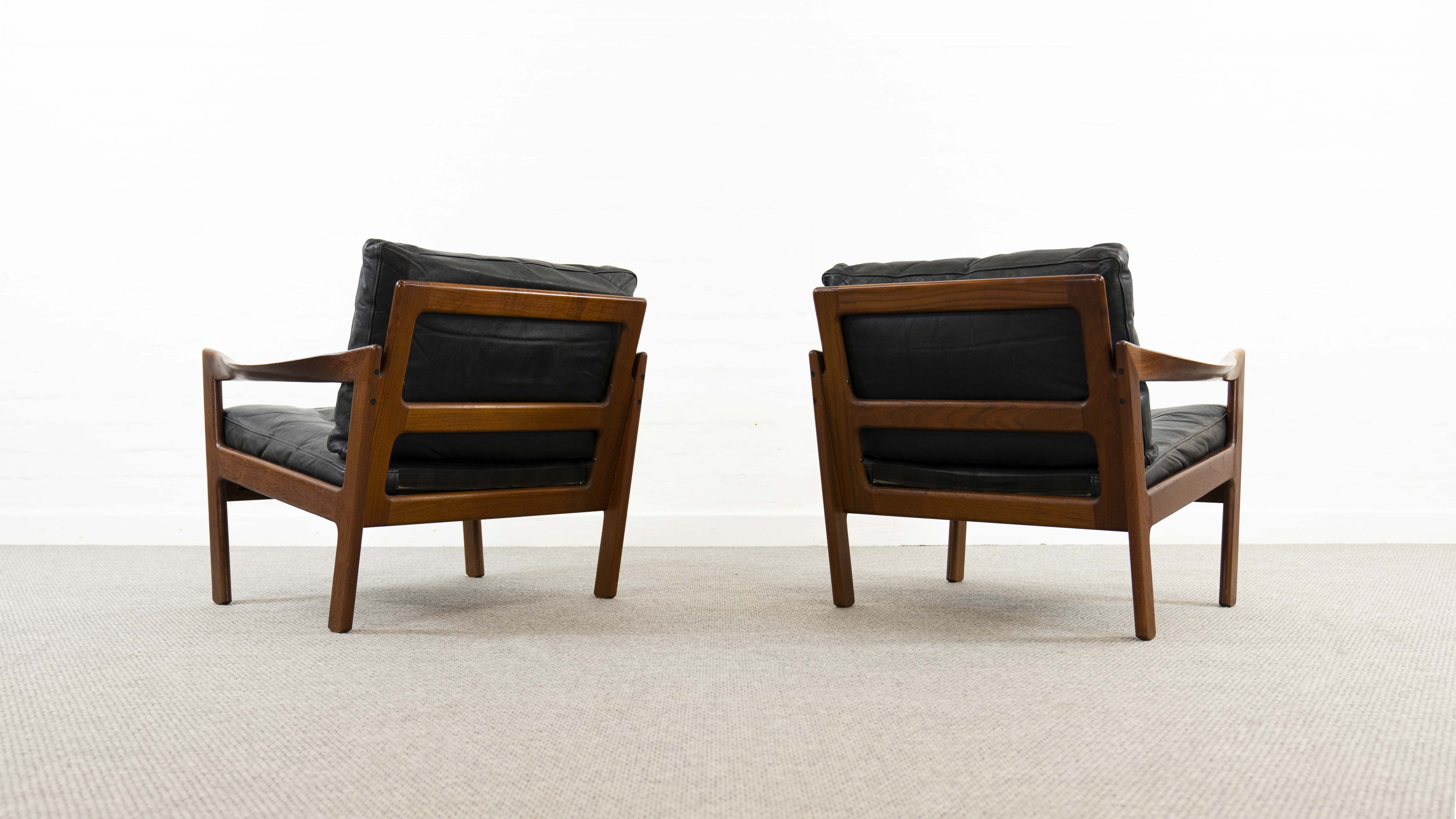 Pair of teak chairs in black leather by Illum Wikkelsoe for Niels Eilersen, Denmark