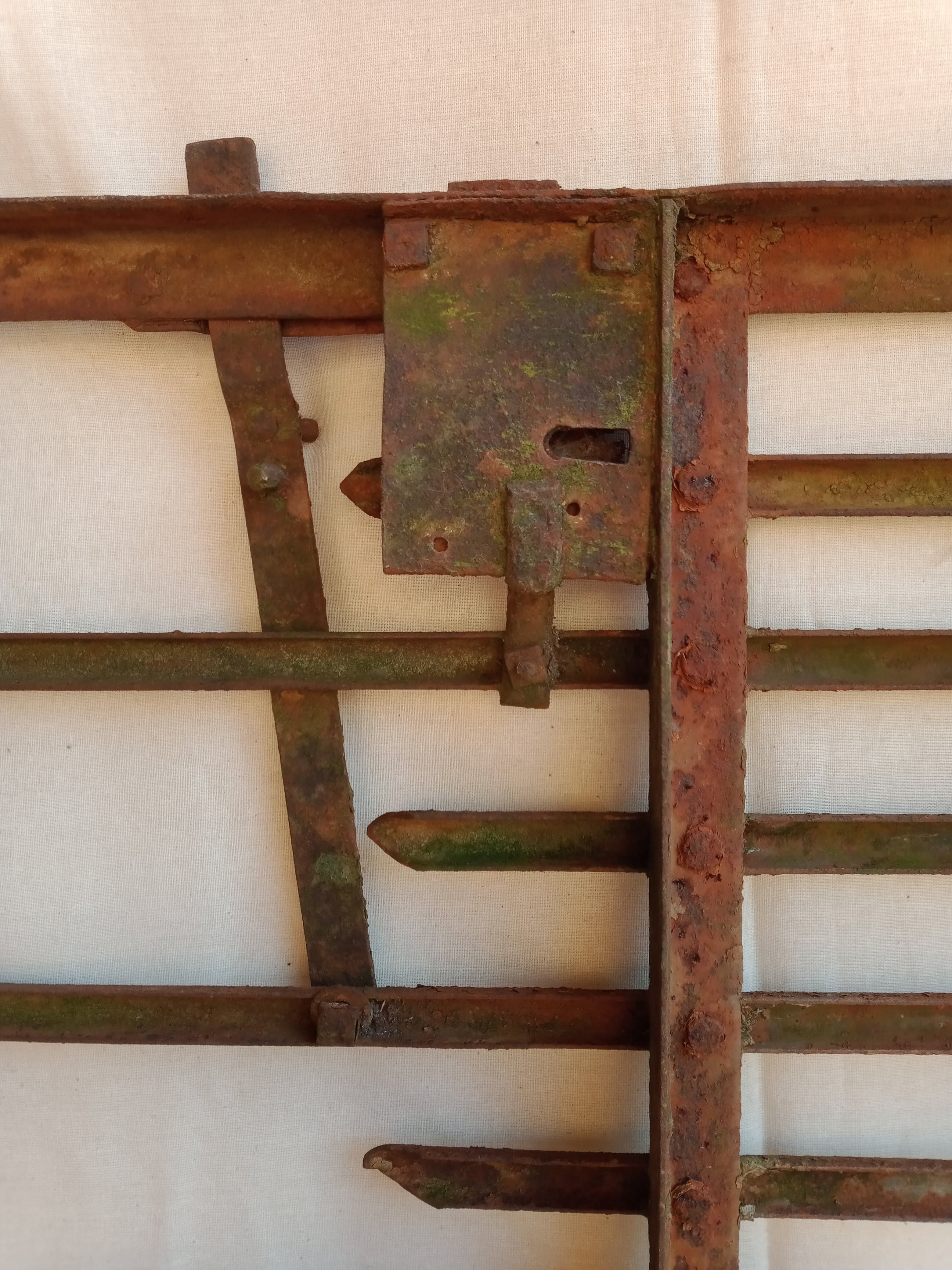 Old riveted metal gate