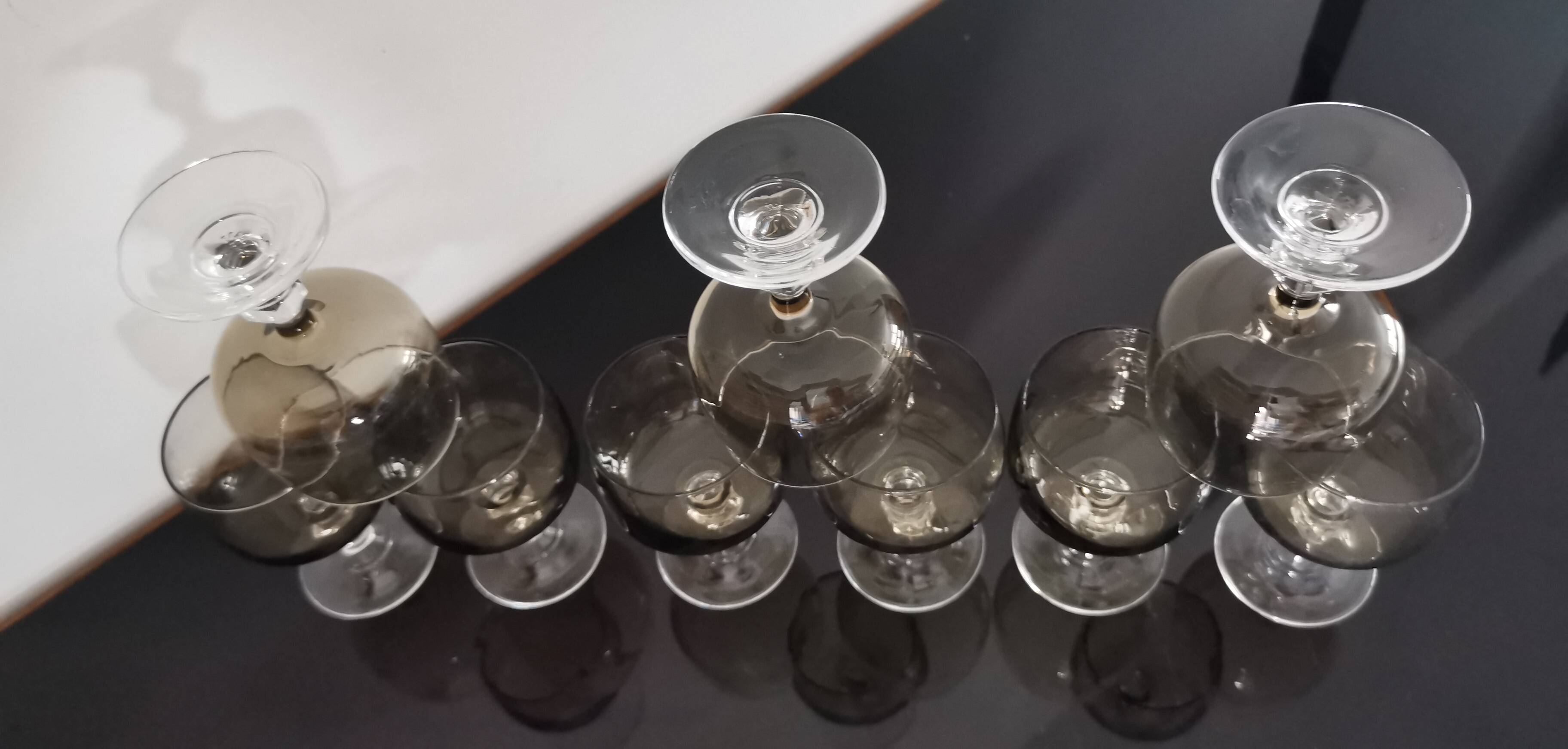 9 white wine glasses on vintage Luminarc smoked black stem