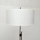 Mid-century German minimalist tripod floor lamp from the 1960s.
