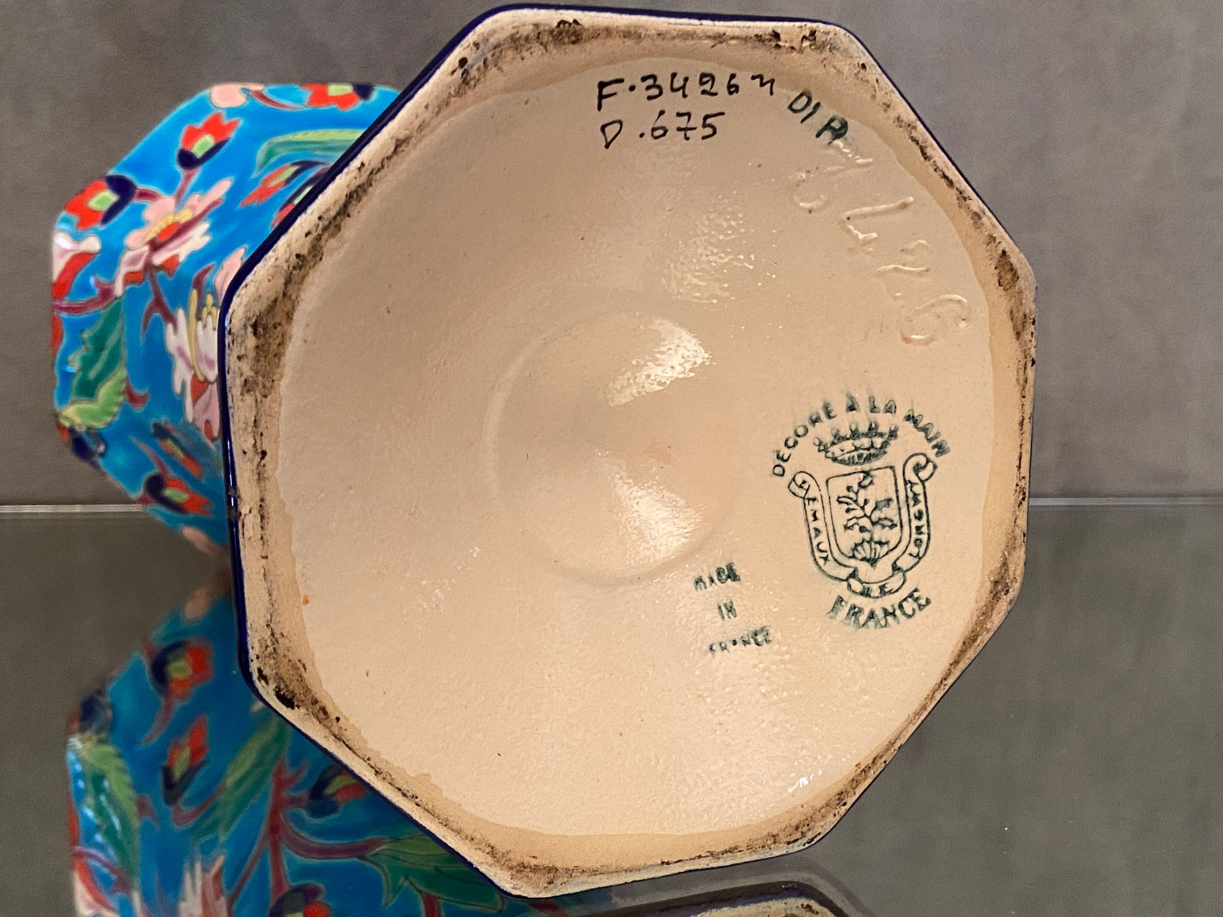 Faience cornet vase with floral decoration signed Emaux de Longwy