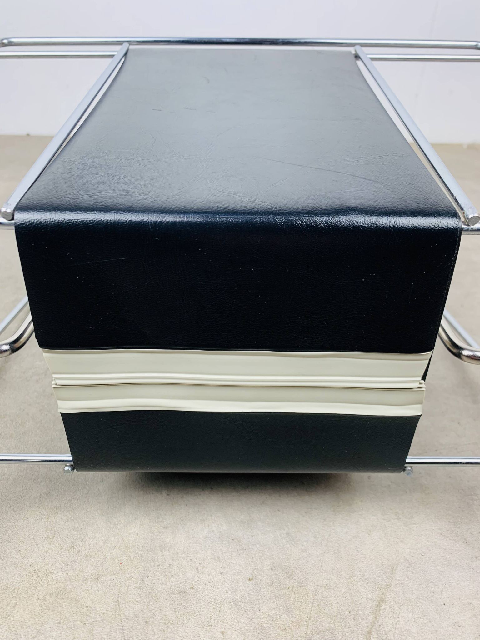 Chrome and black leather magazine rack, 1970s.