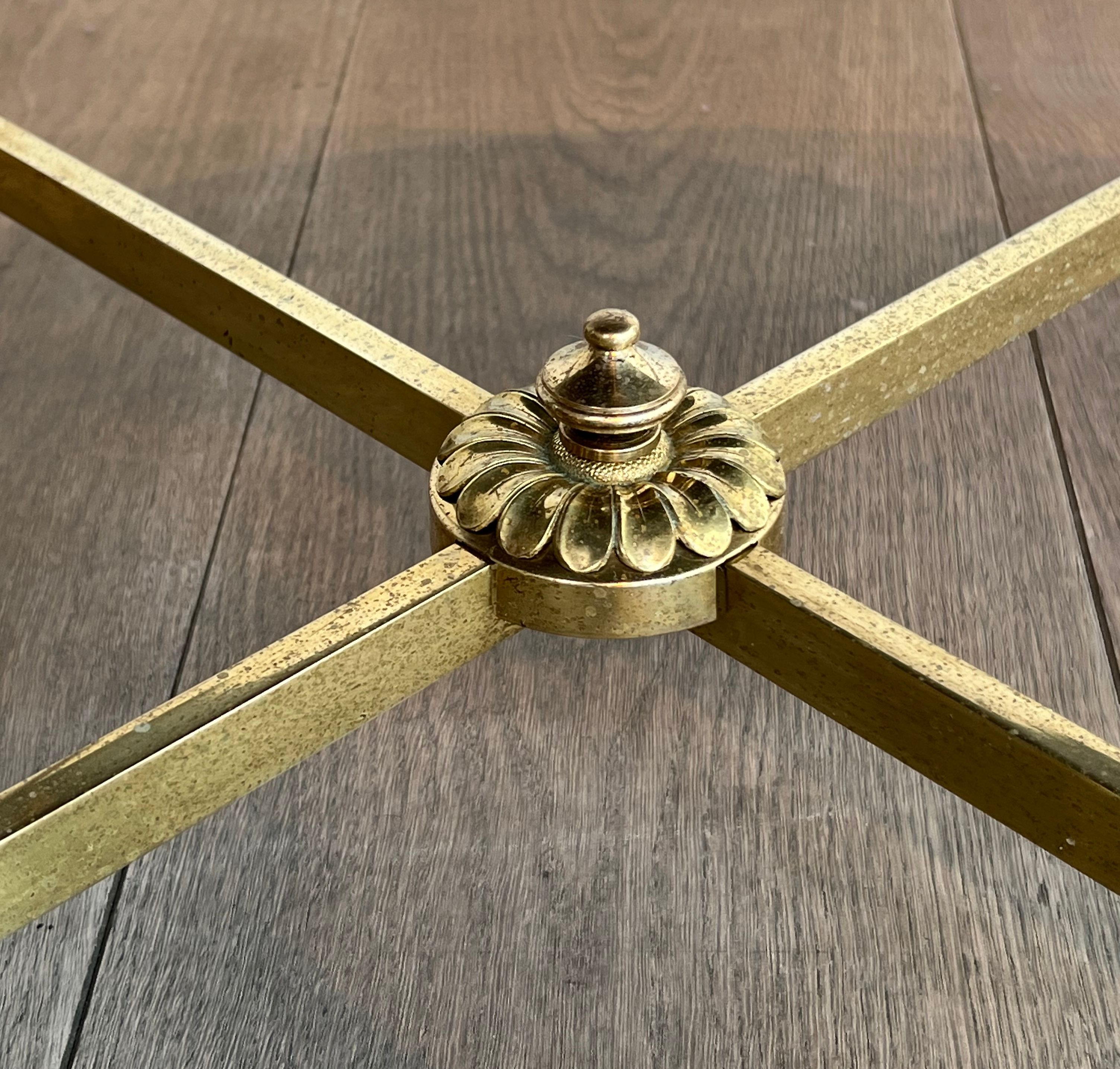 Brass coffee table with a vintage mirror top from the Baguès house.