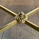 Brass coffee table with a vintage mirror top from the Baguès house.