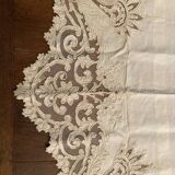 Sheet with embroidered decoration and openwork with cornucopia late nineteenth