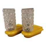 Bathroom lamps in a nice yellow colour with a crystal glass shade and a base of hard thin plastic