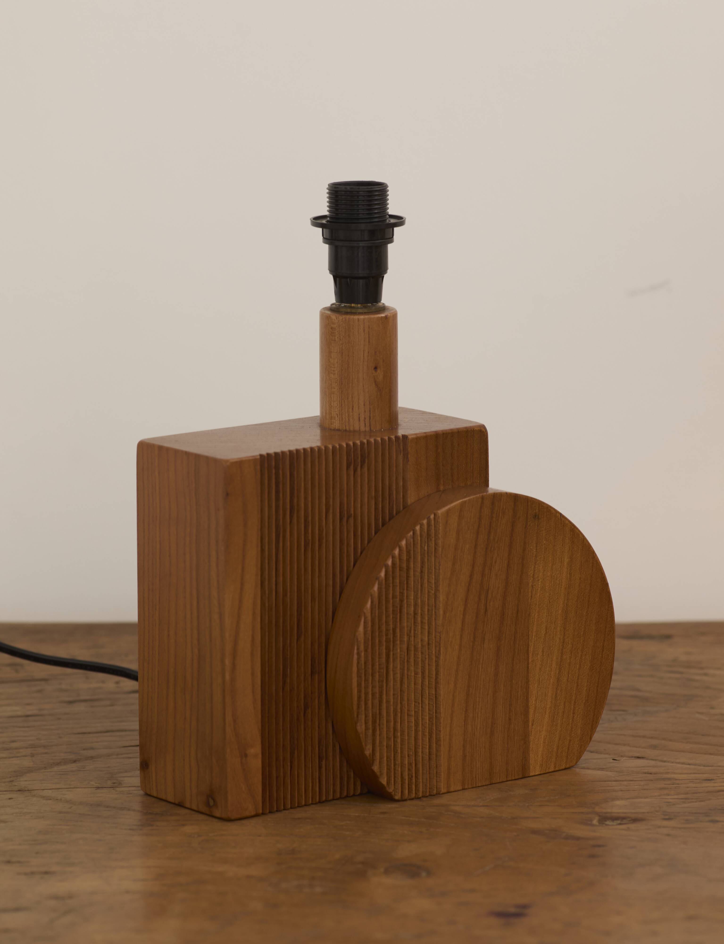 Pair of geometric handcrafted lamps in solid oak circa 1970.