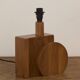 Pair of geometric handcrafted lamps in solid oak circa 1970.